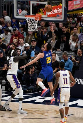 Denver Nuggets guard Austin Rivers 25 goes up for a basket against Los Angeles Lakers forward Wenyen Gabriel (L), during a NBA, Basketball Herren, USA game at the Ball Arena in Denver, CO, USA, 10 April 2022. Denver Nuggets - Los Angeles Lakers !ACHTUNG: NUR REDAKTIONELLE NUTZUNG!  Copyright: xToddxPiersonx AME483 20220411-631ffa2b79720e04639f55a8367009c517346074