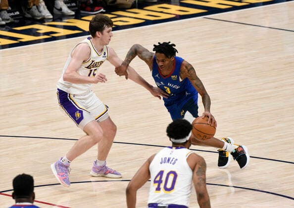 Denver Nuggets guard Bones Hyland (R) drives past Los Angeles Lakers guard Austin Reaves 15 during a NBA, Basketball Herren, USA game at the Ball Arena in Denver, CO, USA, 10 April 2022. Denver Nuggets - Los Angeles Lakers !ACHTUNG: NUR REDAKTIONELLE NUTZUNG!  Copyright: xToddxPiersonx AME485 20220411-5d2f3ead5ea3ba90c8df12b09c63b4752f275cec