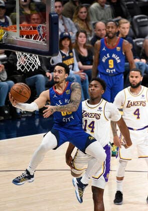Denver Nuggets guard Markus Howard goes in for a basket as Los Angeles Lakers forward Stanley Johnson looks on, during a NBA, Basketball Herren, USA game at the Ball Arena in Denver, CO, USA, 10 April 2022. Denver Nuggets - Los Angeles Lakers !ACHTUNG: NUR REDAKTIONELLE NUTZUNG!  Copyright: xToddxPiersonx AME493 20220411-657efe90d06609f291674c44599ea7602913dd7a