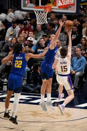 Los Angeles Lakers guard Austin Reaves (R) goes up for a shot against Denver Nuggets forward Vlatko Cancar, during a NBA, Basketball Herren, USA game at the Ball Arena in Denver, CO, USA, 10 April 2022. Denver Nuggets - Los Angeles Lakers !ACHTUNG: NUR REDAKTIONELLE NUTZUNG!  Copyright: xToddxPiersonx AME497 20220411-99d105cb4a093b43dc030f63725153a258342eb9