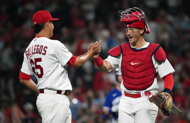 St. Louis Cardinals catcher Andrew Knizner celebrates a 6-5 win over the Kansas City Royals with pitcher Giovanny Gallegos after the third out at Busch Stadium in St. Louis on Tuesday, April 12, 2022.  SLP2022041215 BILLxGREENBLATT