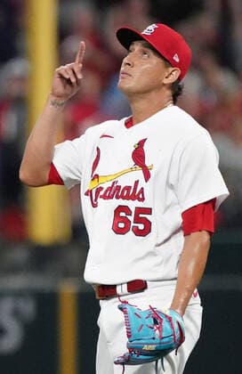St. Louis Cardinals pitcher Giovanny Gallegos points skyward after the third out and a 6-5 win over the Kansas City Royals at Busch Stadium in St. Louis on Tuesday, April 12, 2022.  SLP2022041216 BILLxGREENBLATT