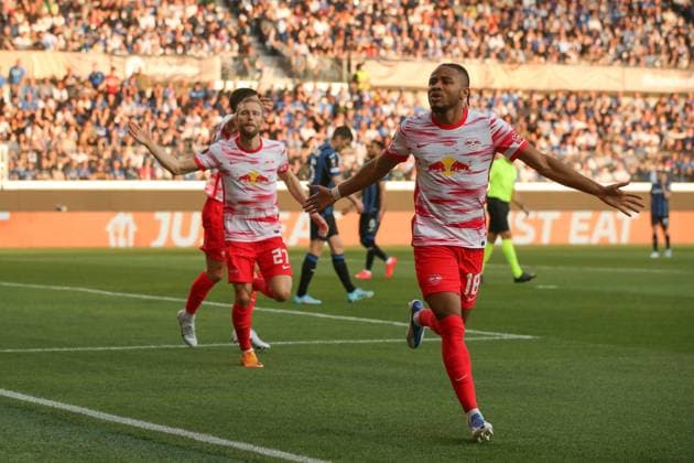 Bergamo, Italy, 14th April 2022. Christopher Nkunku of RB Leipzig celebrates with team mates after scoring to give the side a 1-0 lead during the UEFA Europa League match at Gewiss Stadium, Bergamo. Picture credit should read: Jonathan Moscrop Sportimage EDITORIAL USE ONLY. No use with unauthorised audio, video, data, fixture lists, club league logos or live services. Online in-match use limited to 120 images, no video emulation. No use in betting, games or single club league player publications. SPI-1637-0011