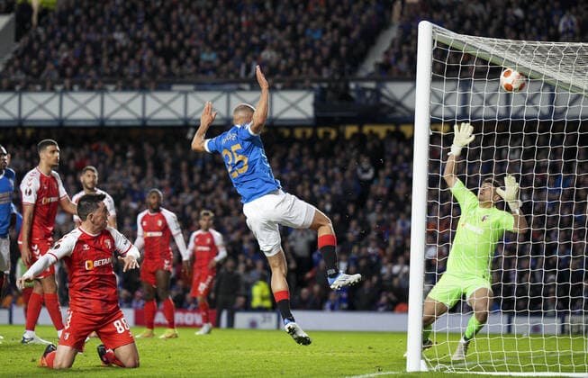 Mandatory Credit: Photo by Stuart Wallace Shutterstock (12893325at) Kemar Roofe of Rangers heads against the crossbar with SC Braga goalkeeper Matheus beaten. Rangers v Braga, UEFA Europa League, Quarter Final, Second Leg, Football, Ibrox Stadium, Glasgow, UK - 14 Apr 2022 EDITORIAL USE ONLY No use with unauthorised audio, video, data, fixture lists, club league logos or live services. Online in-match use limited to 120 images, no video emulation. No use in betting, games or single club league player publications. Rangers v Braga, UEFA Europa League, Quarter Final, Second Leg, Football, Ibrox Stadium, Glasgow, UK - 14 Apr 2022 EDITORIAL USE ONLY No use with unauthorised audio, video, data, fixture lists, club league logos or live services. Online in-match use limited to 120 images, no video emulation. No use in betting, games or single club league player publications. Copyright: xStuartxWallace Shutterstockx 12893325at