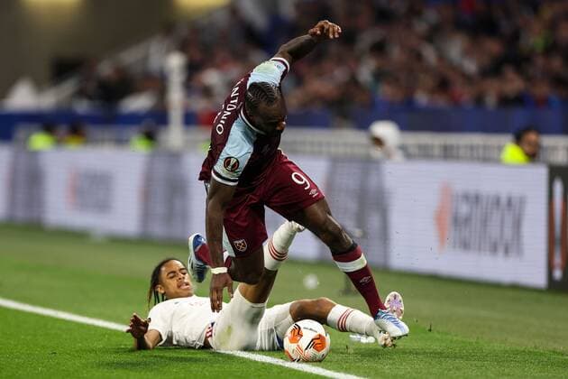 Mandatory Credit: Photo by Simon Dael Shutterstock (12893327da) Michail Antonio of West Ham United and Malo Gusto of Lyon Olympique Lyonnais v West Ham United, UEFA Europa League, Quarter Final, Second Leg, Football, Groupama Stadium, Lyon, France - 14 Apr 2022 EDITORIAL USE ONLY No use with unauthorised audio, video, data, fixture lists, club league logos or live services. Online in-match use limited to 120 images, no video emulation. No use in betting, games or single club league player publications. Olympique Lyonnais v West Ham United, UEFA Europa League, Quarter Final, Second Leg, Football, Groupama Stadium, Lyon, France - 14 Apr 2022 EDITORIAL USE ONLY No use with unauthorised audio, video, data, fixture lists, club league logos or live services. Online in-match use limited to 120 images, no video emulation. No use in betting, games or single club league player publications. Copyright: xSimonxDael Shutterstockx 12893327da