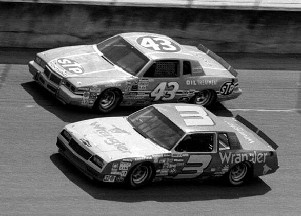 4 July 1984: Richard Petty races alongside Dale Earnhardt at Daytona enroute to his 200th career Winston Cup victor. Mandatory Credit: Brian Cleary Icon SMI 7360074 Richard Petty Icon7360074