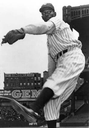 NEW YORK, NY - 1943: Satchel Paige, pitcher for the New York Black Yankees, warms up before a game in 1943 in Yankee Stadium, New York City. MLB, Baseball Herren, USA Archive Icon208543157