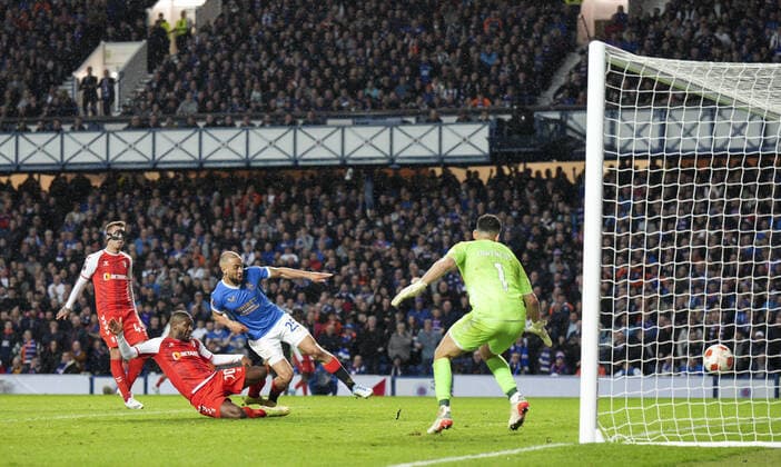 Mandatory Credit: Photo by Stuart Wallace Shutterstock (12893325bj) Kemar Roofe of Rangers scores to give Rangers a 3-1 lead (agg. 3-2), with Andre Horta of SC Braga, left, & SC Braga goalkeeper Matheus, right. Rangers v Braga, UEFA Europa League, Quarter Final, Second Leg, Football, Ibrox Stadium, Glasgow, UK - 14 Apr 2022 EDITORIAL USE ONLY No use with unauthorised audio, video, data, fixture lists, club league logos or live services. Online in-match use limited to 120 images, no video emulation. No use in betting, games or single club league player publications. Rangers v Braga, UEFA Europa League, Quarter Final, Second Leg, Football, Ibrox Stadium, Glasgow, UK - 14 Apr 2022 EDITORIAL USE ONLY No use with unauthorised audio, video, data, fixture lists, club league logos or live services. Online in-match use limited to 120 images, no video emulation. No use in betting, games or single club league player publications. Copyright: xStuartxWallace Shutterstockx 12893325bj