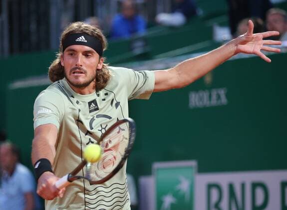 (220416) -- ROQUEBRUNE CAP MARTIN, April 16, 2022 -- Greece s Stefanos Tsitsipas returns the ball during the men s singles quarter-final match against Argentina s Diego Schwartzman at the Monte-Carlo Masters tennis tournament in Roquebrune Cap Martin, France, April 15, 2022. (Photo by Xinhua) (SP)FRANCE-ROQUEBRUNE CAP MARTIN-TENNIS-MONTE-CARLO MASTERS SergexHaouzi 