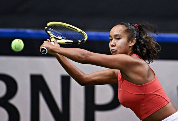 (220417) -- VANCOUVER, April 17, 2022 -- Team Canada s Leylah Annie Fernandez returns the ball to Team Latvia s Daniela Vismane during the Billie Jean King cup qualifiers between Canada and Latvia in Vancouver, Canada, on April 16, 2022. (Photo by Xinhua) (SP)CANADA-VANCOUVER-BILLIE JEAN KING CUP-CANADA VS LATVIA AndrewxSoong 