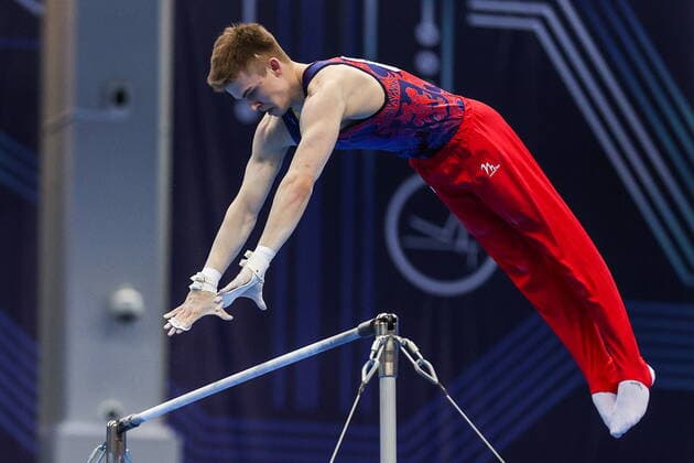 KAZAN, TATARSTAN, RUSSIA - APRIL 17, 2022: Artistic gymnast Ivan Gerget competes in the men s horizontal bar final at the 2022 Russian Artistic Gymnastics Championships at the Gymnastics Centre. Yegor Aleyev TASS  TS12D1B2