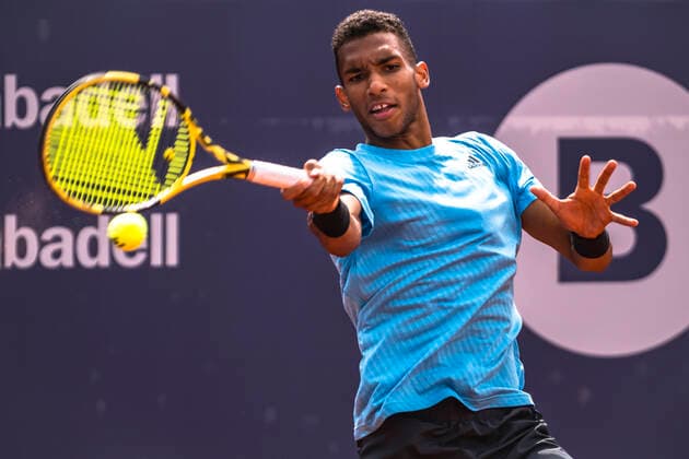 April 22, 2022, Barcelona, Catalonia, Spain: FELIX AUGER-ALIASSIME (CAN) returns the ball to Frances Tiafoe (USA) at Day 5 of the Barcelona Open Banc Sabadell 2022 Barcelona Spain - ZUMAo105 20220422_zap_o105_004 Copyright: xMatthiasxOesterlex