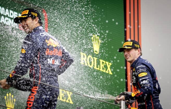 IMOLA - Sergio Perez (11) and Max Verstappen (1) of Oracle Red Bull Racing on the podium after winning the Emilia Romagna F1 Grand Prix at Autodromo Enzo e Dino Ferrari on April 24, 2022 in Imola, Italy. REMKO DE WAAL GP Emilia - Romagna 2022 - RACE 2022 xVIxANPxSportx xxANPxIVx