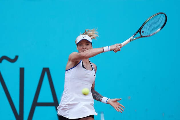 (220430) -- MADRID, April 30, 2022 -- Tereza Martincova of the Czech Republic returns the ball during the women s singles 1st round match against Emma Raducanu of Great Britain at Madrid Open in Madrid, Spain, April 29, 2022. ) (SP)SPAIN-MADRID-TENNIS-MUTUA MADRID OPEN MengxDingbo 