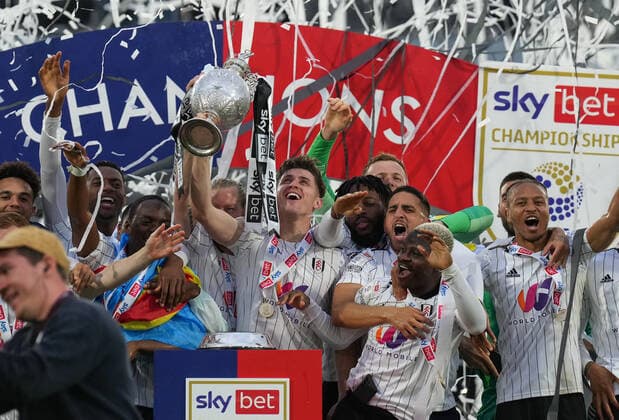 Tom Cairney of Fulham and teammates celebrates winning the EFL Championship during the Sky Bet Championship match between Fulham and Luton Town at Craven Cottage, London, England on 2 May 2022. Copyright: xAndyxRowlandx PMI-4928-0004