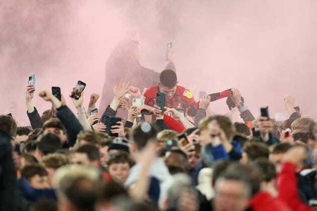 Football - 2021 2022 EFL Sky Bet Championship - AFC Bournemouth vs Nottingham Forest - Vitality Stadium - Tuesday 3rd May 2022 Bournemouth s Ryan Christie is lifted above the crowd after the final whistle after Bournemouth celebrate winning promotion the Premier League at the Vitality Stadium (Dean Court) Bournemouth COLORSPORT Shaun Boggust 