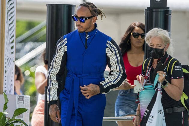 British Formula One driver Lewis Hamilton of Mercedes-AMG Petronas F1 Team and his physiotherapist and assistant Angela Cullen arrive in the paddock during the Formula One Grand Prix of Miami at the Miami International Autodrome in Miami, Florida on May 5, 2022.  FLA20220505104 SHAWNxTHEW