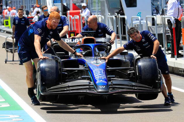 MIAMI GARDENS, FL - MAY 05: Crew members push the car of Williams Racing driver Alexander Albon (23) of Thailand through the pit lane before the Crypto.com Miami Grand Prix on May 5, 2022 at the Miami International Autodrome in Miami Gardens, Florida. (Photo by David J. Griffin Icon Sportswire) AUTO: MAY 05 F1 Crypto.com Miami Grand Prix Icon9532205050411