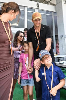 MIAMI GARDENS, FL - MAY 08: Ashton Kutcher and Mila Kunis (center rear) tour the Mercedes-AMG Petronas hospitality suite with their children prior to the start of the Formula 1 CRYPTO.COM Miami Grand Prix on May 8, 2022 at Miami Autodrome in Miami Gardens, FL. (Photo by Doug Murray Icon Sportswire) AUTO: MAY 08 F1 Crypto.com Miami Grand Prix Icon79620220508024