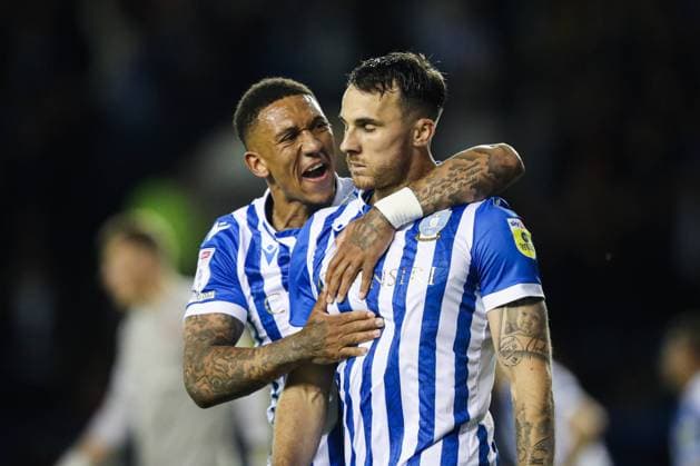 Sheffield, England, 9th May 2022. Lee Gregory of Sheffield Wednesday (right) celebrates scoring their side s first goal of the game during the Sky Bet League 1 match at Hillsborough, Sheffield. Picture credit should read: Isaac Parkin Sportimage EDITORIAL USE ONLY. No use with unauthorised audio, video, data, fixture lists, club league logos or live services. Online in-match use limited to 120 images, no video emulation. No use in betting, games or single club league player publications. SPI-1687-0014