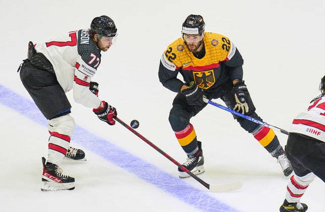 Matthias Plachta Nr.22 of Germany compete, fight for the puck against, Josh Anderson Nr. 77 of Canada in the match GERMANY - CANADA IIHF Ice hockey, Eishockey World Championship, WM, Weltmeisterschaft Group B in Helsinki, Finland, May 13, 2022, Season 2021 2022