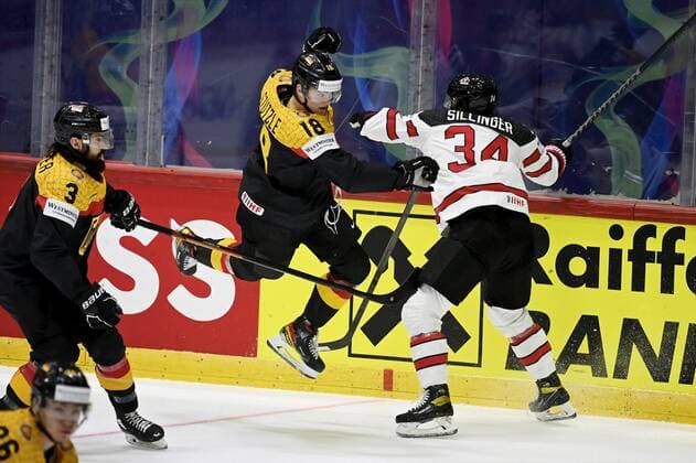 Tim Stutzle of Germany and Cole Sillinger of Canada during the 2022 IIHF Ice hockey, Eishockey World Championships preliminary round group A match between Germany and Canada in Helsinki on May 13th, 2022. Helsinki Finland LKLAPA20220513202719K461  Copyright: xAnttixAimo-Koivistox