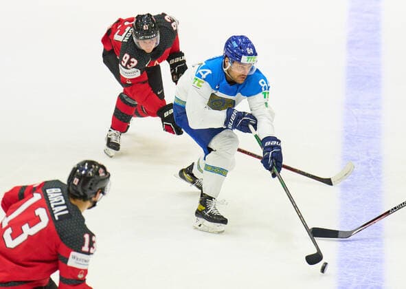 Kirill Savitski Nr.84 of Kazakhstan compete, fight for the puck against, Kent Johnson Nr. 93 of Canada Matt Barzal Nr. 13 of Canada in the match CANADA - KAZAKHSTAN of the IIHF Ice hockey, Eishockey World Championship, WM, Weltmeisterschaft Group B in Helsinki, Finland, May 19, 2022, Season 2021 2022
