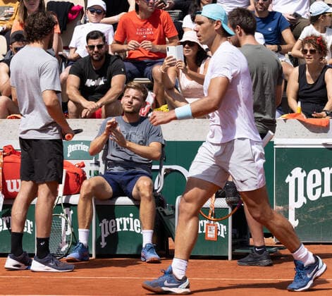 Spanish Rafael Nadal, passes by and Belgian David Goffin during a training session ahead of the Roland Garros French Open tennis tournament, in Paris, France, Saturday 21 May 2022. This year s tournament takes place from 22 May to 5 June. BENOITxDOPPAGNE  x35349285x