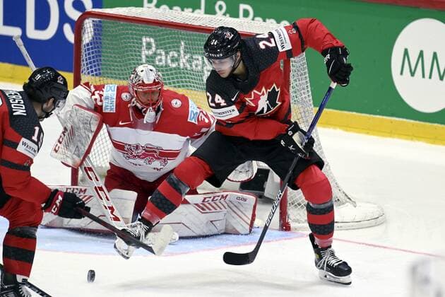 Goalkeeper Sebastian Dahm (C) of Denmark keeps an eye on the puck as Drake Batherson (L) and Dylan Cozens of Canada attack during the 2022 IIHF Ice hockey, Eishockey World Championships preliminary round group A match between Canada and Denmark in Helsinki on May 23, 2022. Helsinki Finland LKFTJK20220523202554HUQB  Copyright: xVesaxMoilanenx