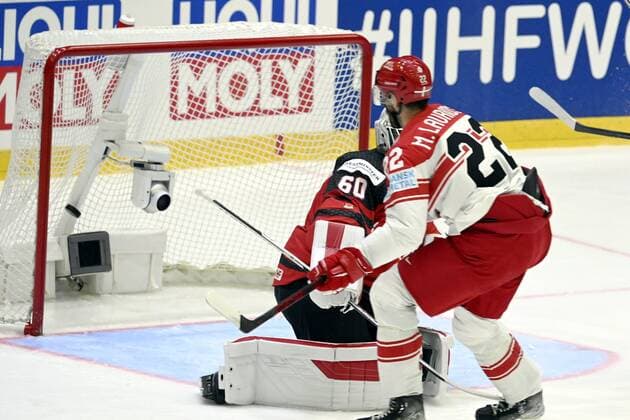 Markus Lauridsen (R) of Denmark scores the game opening goal past goalkeeper Chris Driedger of Canada during the 2022 IIHF Ice hockey, Eishockey World Championships preliminary round group A match between Canada and Denmark in Helsinki on May 23, 2022. Helsinki Finland LKFTJK20220523204608RPWU  Copyright: xVesaxMoilanenx