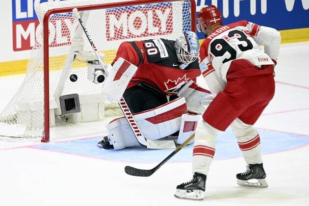 Peter Regin (R) of Denmark scores a goal past goalkeeper Chris Driedger of Canada during the 2022 IIHF Ice hockey, Eishockey World Championships preliminary round group A match between Canada and Denmark in Helsinki on May 23, 2022. Helsinki Finland LKFTJK20220523204734JBZK  Copyright: xVesaxMoilanenx