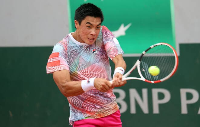US tennis player Brandon Nakashima returns the ball to Polish Kamil Majchrzak during their French Tennis Open match at Roland Garros near Paris, France, on Monday May 23, 2022. Nakashima won 6-4, 7-6, 6-2.  PAR20220523103 MAYAxVIDON-WHITE