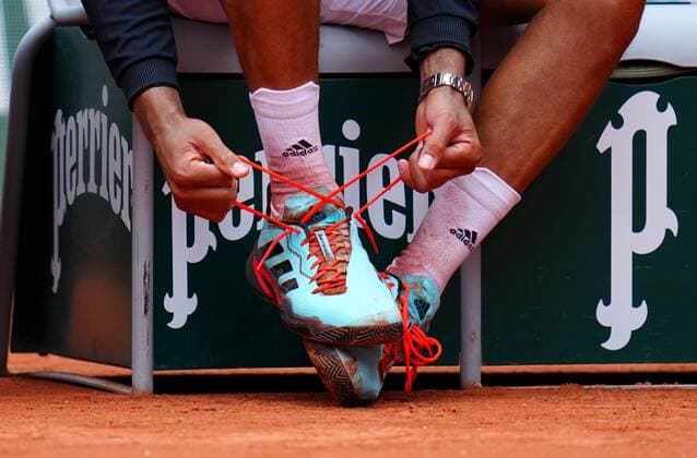 Mandatory Credit: Photo by Javier Garcia Shutterstock (12954043cs) Jo Wilfried Tsonga unlaces his Adidas tennis shoes after his last ever match before retiring French Open Tennis, Day 3, Roland Garros, Paris, France - 24 May 2022 French Open Tennis, Day 3, Roland Garros, Paris, France - 24 May 2022  Copyright: xJavierxGarcia Shutterstockx 12954043cs