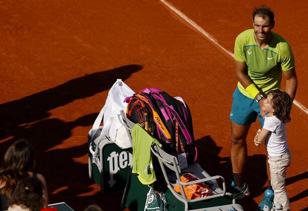 Mandatory Credit: Photo by Ella Ling Shutterstock (12956278ay) Rafael Nadal of Spain greets a child fan who comes on to the court following his match French Open Tennis, Day 6, Roland Garros, Paris, France - 27 May 2022 French Open Tennis, Day 6, Roland Garros, Paris, France - 27 May 2022  Copyright: xEllaxLing Shutterstockx 12956278ay
