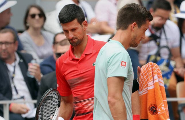 Top-seeded Novak Djokovic of Serbia and Aljaz Bedene of Slovenia swap ends during their French Tennis Open match at Roland Garros near Paris, France, on Friday May 27, 2022. Djokovic won 6-3, 6-3, 6-2.  PAR20220527114 MAYAxVIDON-WHITE
