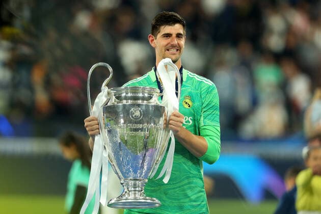 28th May 2022; Stade de France stadium, Saint-Denis, Paris, France. Champions League football final between Liverpool FC and Real Madrid; Thibaut Courtois of Real Madrid celebrates with the Champions League Trophy  ActionPlus12394266 ShaunxBrooks