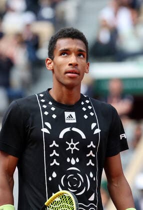 Canadian Felix Auger-Aliassime returns the ball to Spanish Rafael Nadal during their French Tennis Open match at Roland Garros near Paris, France, on Sunday May 29, 2022. Nadal won 3-6, 6-3, 6-2, 3-6, 6-3.  PAR20220529146 MAYAxVIDON-WHITE