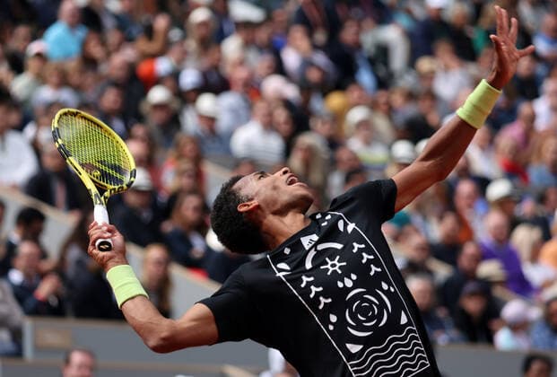 Canadian Felix Auger-Aliassime returns the ball to Spanish Rafael Nadal during their French Tennis Open match at Roland Garros near Paris, France, on Sunday May 29, 2022. Nadal won 3-6, 6-3, 6-2, 3-6, 6-3.  PAR20220529144 MAYAxVIDON-WHITE