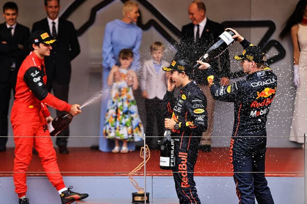 (220530) -- MONTE CARLO, May 30, 2022 -- Winner Red Bull Racing s driver Sergio Perez (C), second-placed Ferrari s driver Carlos Sainz (L) and third-placed Red Bull Racing s driver Max Verstappen celebrate with champagne on the podium after the final of the Formula One Grand Prix of Monaco at the Circuit de Monaco in Monte Carlo, Monaco, May 29, 2022. (Photo by Xinhua) (SP)MONACO-MONTE CARLO-F1 GRAND PRIX-MONACO-FINAL QianxJun 