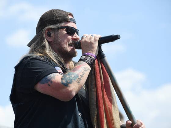 CHARLOTTE, NC - MAY 29: Johnny Van Zant, lead singer of the band Lynyrd Skynyrd performs before the running of the NASCAR, Motorsport, USA Cup Series Coca-Cola 600 on May 29, 2022, at Charlotte Motor Speedway in Concord, NC.(Photo by Jeffrey Vest Icon Sportswire) AUTO: MAY 29 NASCAR Cup Series Coca-Cola 600 Icon220529002