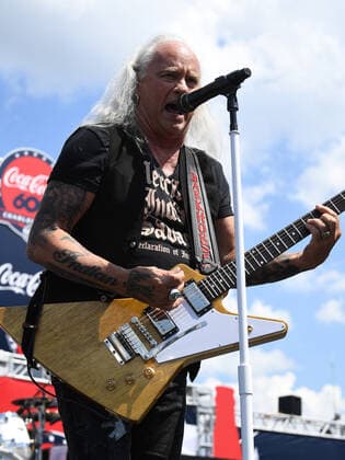 CHARLOTTE, NC - MAY 29: Ricky Medlocke for the band Lynyrd Skynyrd performs during the pre-race activities before running of the NASCAR, Motorsport, USA Cup Series Coca-Cola 600 on May 29, 2022, at Charlotte Motor Speedway in Concord, NC.(Photo by Jeffrey Vest Icon Sportswire) AUTO: MAY 29 NASCAR Cup Series Coca-Cola 600 Icon220529009