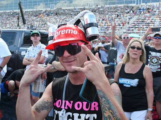 CHARLOTTE, NC - MAY 29: A race fan watches Lynyrd Skynyrd perform during the pre-race activities before the running of the NASCAR, Motorsport, USA Cup Series Coca-Cola 600 on May 29, 2022, at Charlotte Motor Speedway in Concord, NC.(Photo by Jeffrey Vest Icon Sportswire) AUTO: MAY 29 NASCAR Cup Series Coca-Cola 600 Icon220529309