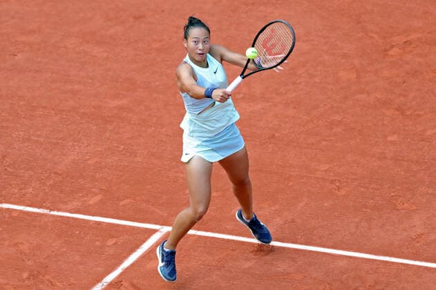 30th May 2022; Roland Garros, Paris, France: French Open Tennis tournament: Qinwen Zheng (CHN) returns with a backhand to Iga Swiatek (POL)  ActionPlus12395294 JonxBromley