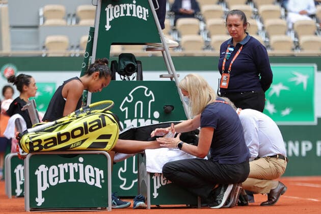 31st May 2022; Roland Garros, Paris, France: French Open Tennis tournament: Leylah Fernandez (CAN) is attended to by a medic for a foot issue during her match against Martina Trevisan (ITA)  ActionPlus12395316 JonxBromley
