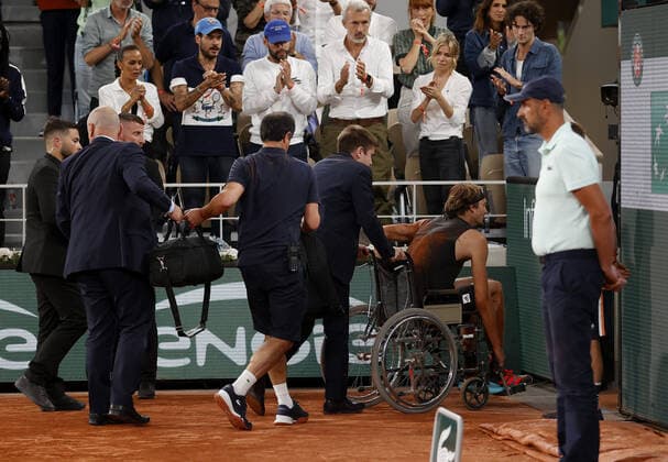 Mandatory Credit: Photo by Ella Ling Shutterstock (12959951d) Alexander Zverev of Germany is led off court in a wheelchair following a fall French Open Tennis, Day 13, Roland Garros, Paris, France - 03 Jun 2022 French Open Tennis, Day 13, Roland Garros, Paris, France - 03 Jun 2022  Copyright: xEllaxLing Shutterstockx 12959951d