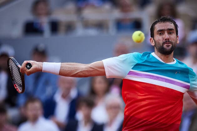 (220604) -- PARIS, June 4, 2022 -- Marin Cilic of Croatia hits a return during the men s singles semifinal against Casper Ruud of Norway at the French Open tennis tournament at Roland Garros in Paris, France, June 3, 2022. ) (SP)FRANCE-PARIS-TENNIS-ROLAND GARROS-FRENCH OPEN-MEN S SINGLES SEMIFINAL MengxDingbo 