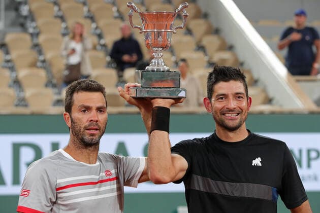 4th June 2022; Roland Garros, Paris, France: French Open Tennis tournament, mens doubles final; Marcelo Arevalo (ELS) and Jean-Julien Rojer (NED) hold the winners trophy of the Men s Doubles after beating Ivan Dodig (CRO)and Austin Krajicek (USA)  ActionPlus12397006 JonxBromley