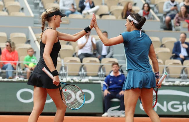 (220605) -- PARIS, June 5, 2022 -- Kristina Mladenovic (L) Caroline Garcia of France celebrate their victory after the women s doubles final against Coco Gauff Jessica Pegula of the United States at the French Open tennis tournament at Roland Garros in Paris, France, June 5, 2022. ) (SP)FRANCE-PARIS-TENNIS-ROLAND GARROS-FRENCH OPEN-WOMEN S DOUBLES FINAL GaoxJing 