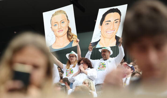 (220605) -- PARIS, June 5, 2022 -- Supporters of Kristina Mladenovic Caroline Garcia of France hold their pictures during the women s doubles final at the French Open tennis tournament at Roland Garros in Paris, France, June 5, 2022. ) (SP)FRANCE-PARIS-TENNIS-ROLAND GARROS-FRENCH OPEN-WOMEN S DOUBLES FINAL GaoxJing 