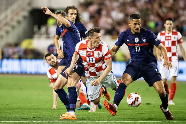 Croatia v France: UEFA Nations League - League Path Group 1 SPLIT, CROATIA - JUNE 06: Ante Budimir of Croatia competes for a ball with Adrien Rabiot (L) and William Saliba (R) of France during the UEFA Nations League League A Group 1 match between Croatia and France at Stadion Poljud on June 6, 2022 in Split, Croatia. MilanxSabic PIXSELL